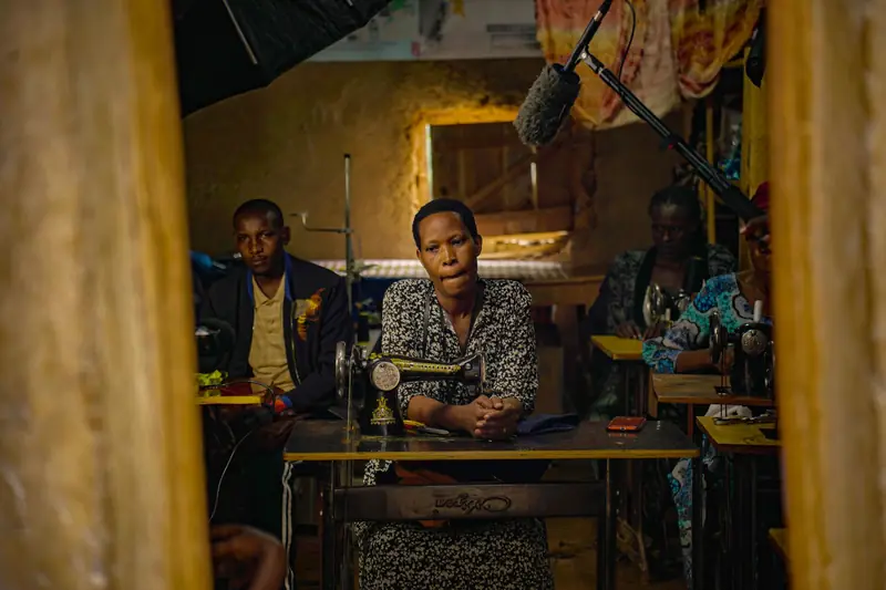 Tailors at work at sewing machines in a workshop