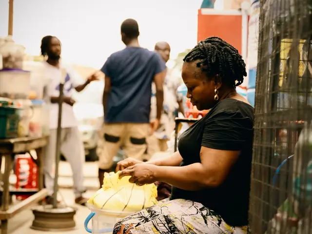 A market trader preparing goods at her stall